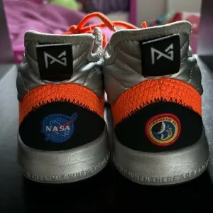NASA themes Nike shoes. Size 5.5Y with very light wear-n-tear as seen in photos.